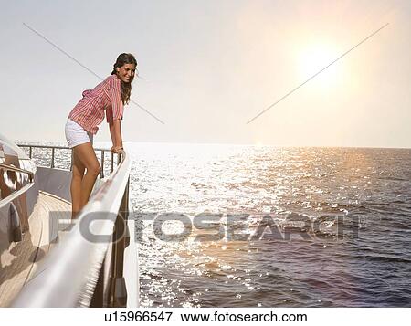 Stock Photo - Woman on Deck of Boat. Fotosearch