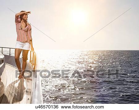 Stock Photograph - Woman on Deck of Boat. Fotosearch