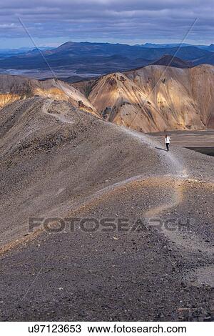 Woman on ridge of hill, Landmannalaugar, Iceland View Large Photo Image Stock Image - Woman on ridge of hill, Landmannalaugar, Iceland. Fotosearch