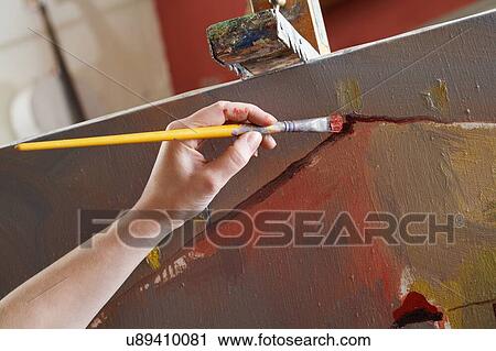 Woman painting on canvas close-up View Large Photo Image Stock Image - Woman painting on canvas close-up. Fotosearch
