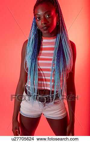 Woman posing against red background View Large Photo Image Picture - Woman posing against red background. Fotosearch