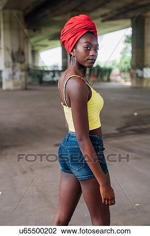 Woman posing under bridge View Large Photo Image Stock Image - Woman posing under bridge. Fotosearch