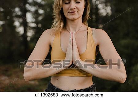 Woman practising yoga in forest View Large Photo Image Stock Image - Woman practising yoga in forest. Fotosearch