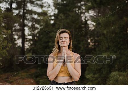 Woman practising yoga in forest View Large Photo Image Stock Image - Woman practising yoga in forest. Fotosearch