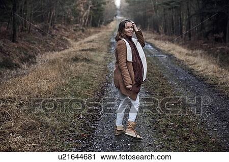 Woman taking walk through forest, Normandie, Orne, France View Large Photo Image Stock Image - Woman taking walk through forest, Normandie, Orne, France. Fotosearch