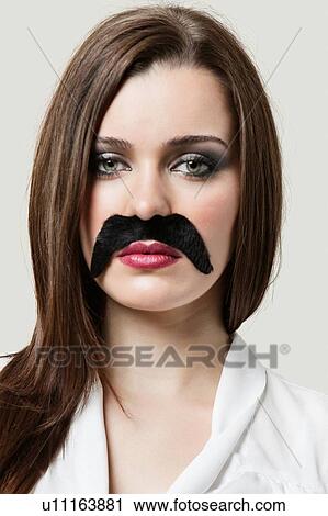 Woman wearing fake moustache View Large Photo Image Stock Image - Woman wearing fake moustache. Fotosearch