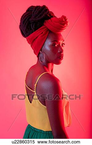 Woman with headscarf posing against pink background View Large Photo Image Stock Photography - Woman with headscarf posing against pink background. Fotosearch