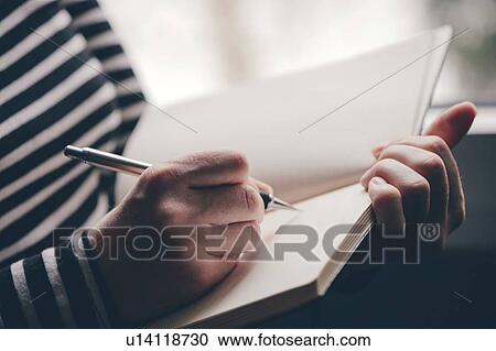 Woman writing in diary View Large Photo Image Stock Image - Woman writing in diary. Fotosearch