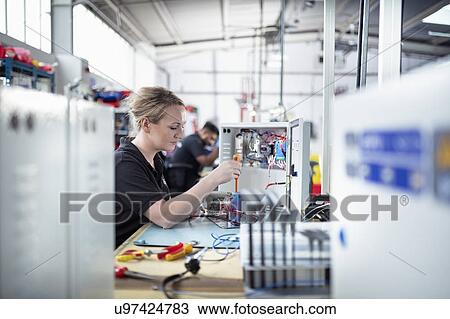 Workers in electronic component assembly line in electronics assembly factory View Large Photo Image Stock Image - Workers in electronic component assembly line in electronics assembly factory. Fotosearch