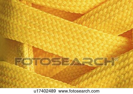 Stock Photo - Yellow shoelaces. Fotosearch