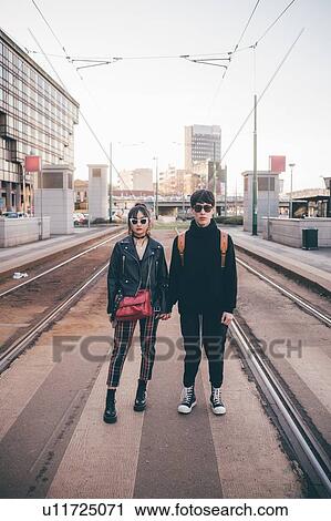 Young couple in train station, Milan, Italy View Large Photo Image Stock Image - Young couple in train station, Milan, Italy. Fotosearch
