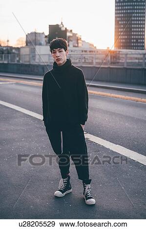 Young man posing in street, Milan, Italy View Large Photo Image Stock Photo - Young man posing in street, Milan, Italy. Fotosearch