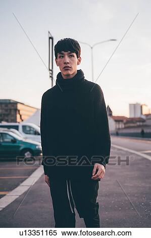Young man posing in street, Milan, Italy View Large Photo Image Stock Photography - Young man posing in street, Milan, Italy. Fotosearch