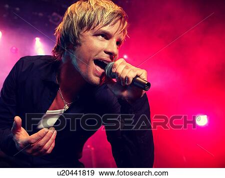 Young Man Singing at rock Concert View Large Photo Image Stock Photo - Young Man Singing at rock Concert. Fotosearch
