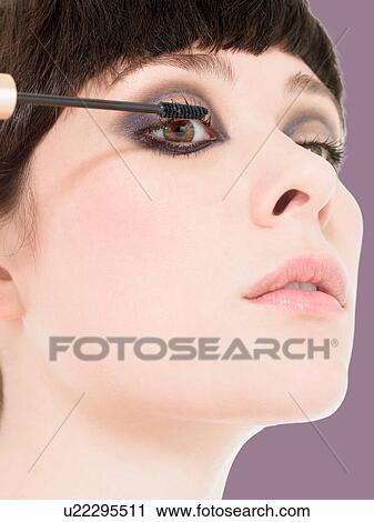 Young Woman Applying Eyeshadow View Large Photo Image Stock Image - Young Woman Applying Eyeshadow. Fotosearch