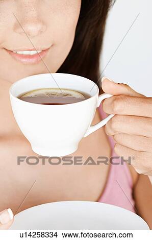 Picture - Young Woman Drinking Lemon Tea. Fotosearch
