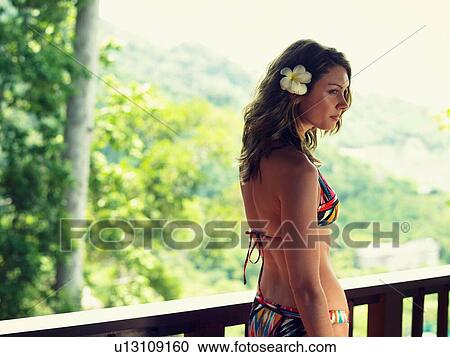 Young Woman in Bikini with Flower in Hair View Large Photo Image Stock Image - Young Woman in Bikini with Flower in Hair. Fotosearch