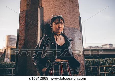 Young woman, pillar in background, Milan, Italy View Large Photo Image Stock Photo - Young woman, pillar in background, Milan, Italy. Fotosearch