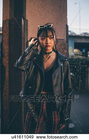 Young woman, pillar in background, Milan, Italy View Large Photo Image Stock Photo - Young woman, pillar in background, Milan, Italy. Fotosearch
