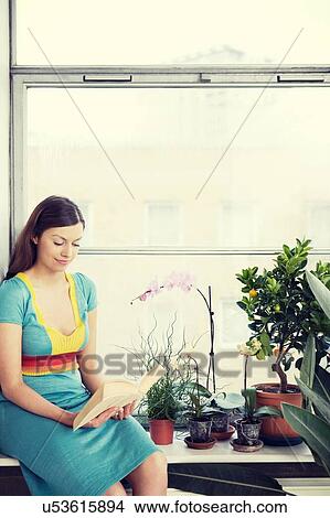 Young woman reading book View Large Photo Image Picture - Young woman reading book. Fotosearch