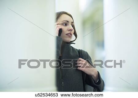 Young woman using smartphone View Large Photo Image Stock Image - Young woman using smartphone. Fotosearch