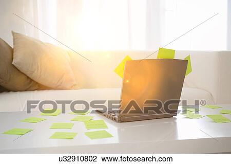 Adhesive notes scattered on table with laptop View Large Photo Image Stock Image - Adhesive notes scattered on table with laptop. Fotosearch