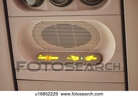 Stock Photo - Airplane seat belt sign on . Fotosearch