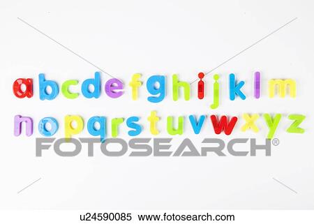 Stock Photography - Alphabet magnets arranged in order over white background. Fotosearch