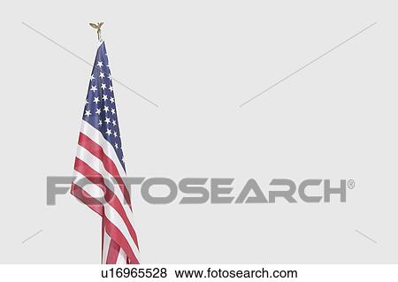 Stock Photo - American flag over gray background. Fotosearch