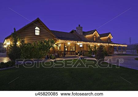 Angular view of ranch home at dusk View Large Photo Image Stock Photography - Angular view of ranch home at dusk. Fotosearch