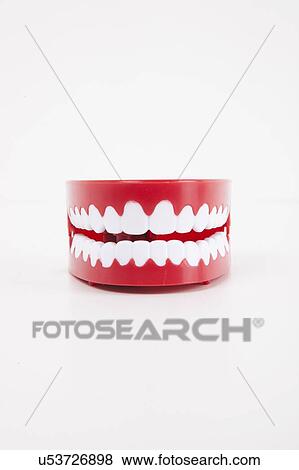 Stock Photo - Artificial dentures over white background. Fotosearch