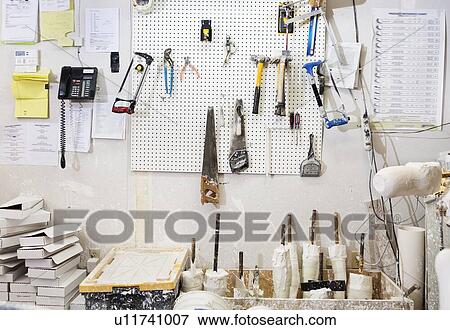 Assorted workshop tools on a pegboard View Large Photo Image Stock Photo - Assorted workshop tools on a pegboard. Fotosearch