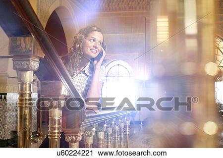 Attractive Brunette Woman Telephoning in Hotel Lobby View Large Photo Image Stock Image - Attractive Brunette Woman Telephoning in Hotel Lobby. Fotosearch