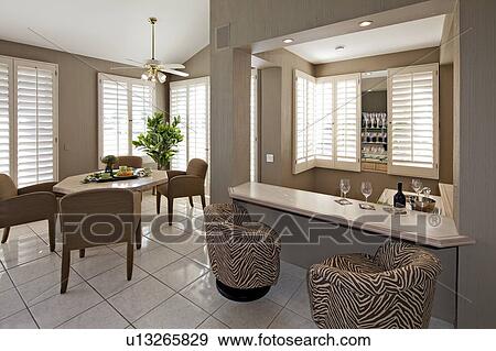Bar counter with dining table and chair in luxurious villa View Large Photo Image Stock Photo - Bar counter with dining table and chair in luxurious villa. Fotosearch