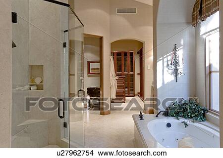 Picture - Bathtub with glass door in bathroom of luxury manor house. Fotosearch