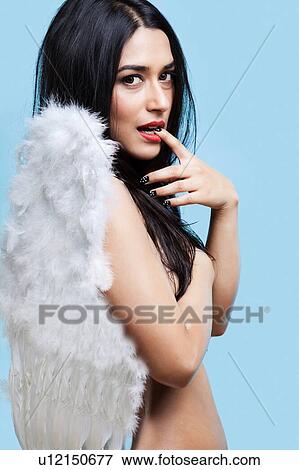 Stock Photo - Beautiful indian female wearing angel wings. Fotosearch