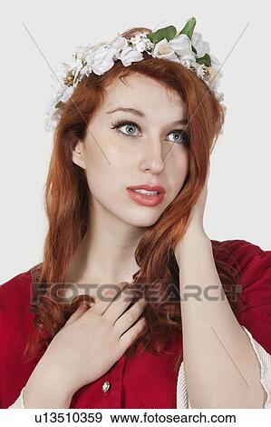 Beautiful young woman in old-fashioned princess costume looking away against gray background View Large Photo Image Stock Photo - Beautiful young woman in old-fashioned princess costume looking away against gray background. Fotosearch
