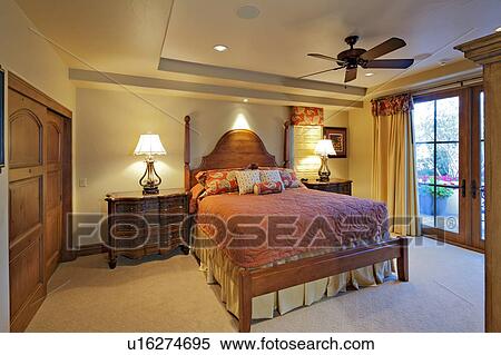 Stock Photography - Big comfortable bed in luxury manor house. Fotosearch