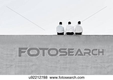 Black and white photo of mature thoughtful businessmen sitting on office rooftop View Large Photo Image Stock Photo - Black and white photo of mature thoughtful businessmen sitting on office rooftop. Fotosearch