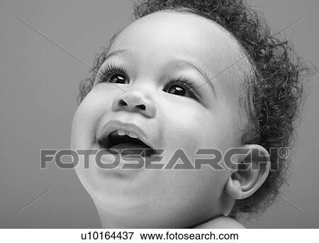 Stock Photo - Black and white photo of smiling black baby. Fotosearch