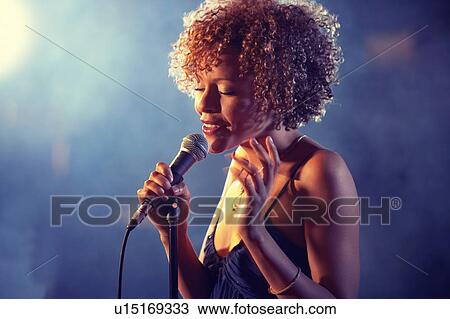 Black female Singer Performing on stage View Large Photo Image Stock Image - Black female Singer Performing on stage. Fotosearch