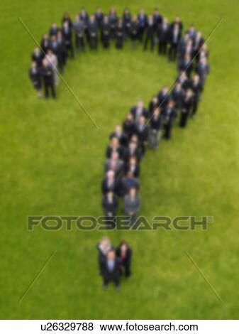 Stock Photo - Blurred group of business people in question mark shape. Fotosearch