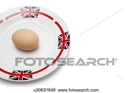 Brown egg in plate over white background View Large Photo Image Stock Photo - Brown egg in plate over white background. Fotosearch