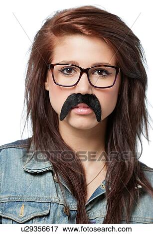 Stock Photo - Brunette woman wearing fake moustache. Fotosearch