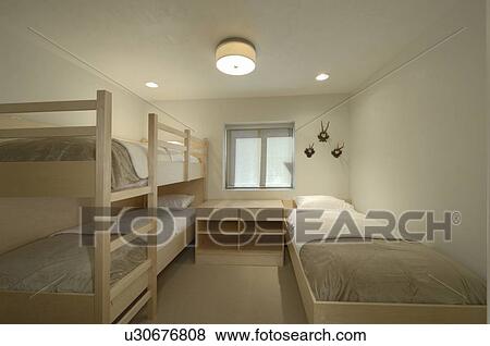Stock Photo - Bunk bed in bedroom of mansion. Fotosearch