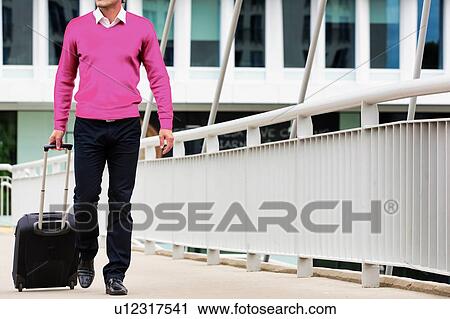 Businessman attending business conference in a hotel View Large Photo Image Stock Image - Businessman attending business conference in a hotel. Fotosearch