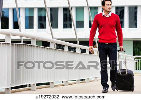 Stock Image - Businessman attending business conference in a hotel. Fotosearch