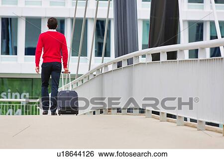 Businessman attending business conference in a hotel View Large Photo Image Stock Photograph - Businessman attending business conference in a hotel. Fotosearch