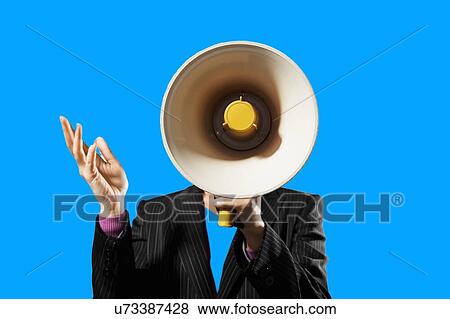 Stock Photo - Businesswoman Holding Megaphone against blue background. Fotosearch