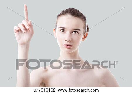 Caucasian woman holding finger in air View Large Photo Image Stock Image - Caucasian woman holding finger in air. Fotosearch